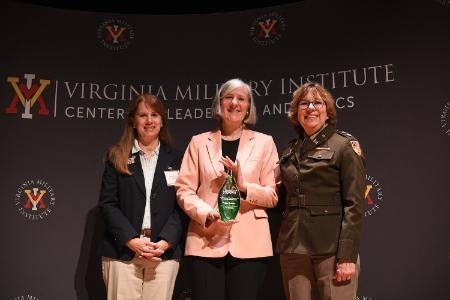 Margaret L. “Peggy” Sanner, flanked by last year’s winner, Laura McKay and Lt. Col. Kim Connolly, accepts the Erchul Environmental Leadership Award.