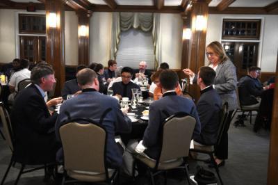 Cadets at 鶹ŮԱ Institute learned dining and conversation etiquette at an evening event sponsored by the school's Building BRIDGES club.